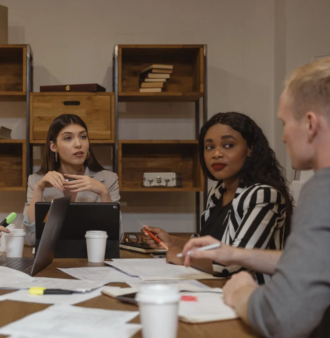 Diverse team collaborating at office table.