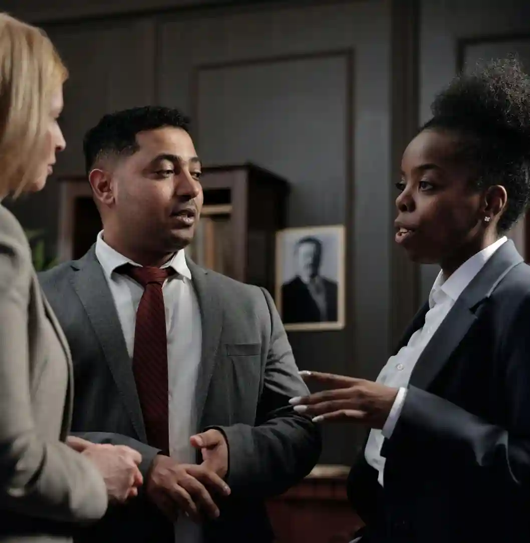 Three colleagues in a serious discussion.